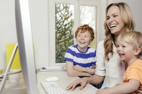 Mom and kids looking at computer