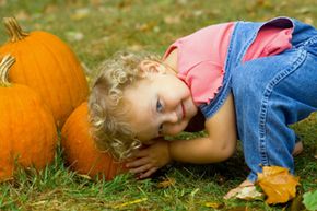 girl and pumpkins