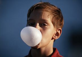 kid blowing bubble