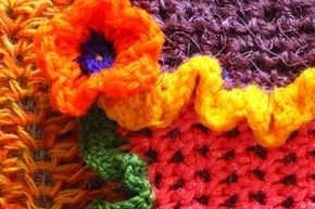 Crochet detail from colorful crocheted scarf.