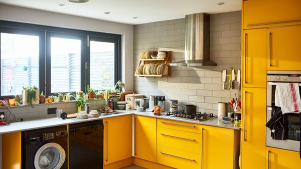 A yellow-themed kitchen with appliances