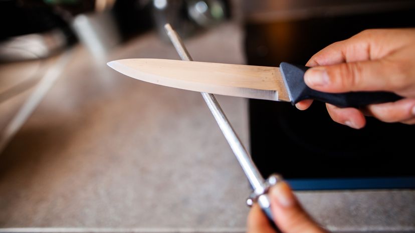 Sharpening Knife in Kitchen