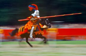 A knight on horseback at a tournament in Bavaria, Germany. See the most famous knight in these pictures of King Arthur.