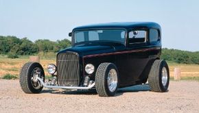 Sharon Kolmos chose a chopped, fenderless 1932 Ford Tudor body for her sedan. See more hot rod pictures.