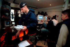 A Kozmo.com messenger prepares deliveries a New York City distribution center in February 2000.