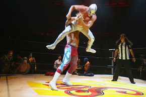El Hijo del Santo (the Son of the Saint) outmaneuvers his opponent.