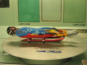 A member of the USA Luge team works on his form in the Allied Aerospace Low Speed Wind Tunnel.