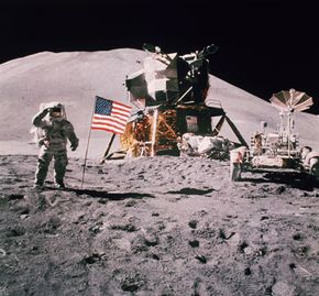 Astronaut James Irwin salutes in front of the landing module of Apollo 15 in August 1971.