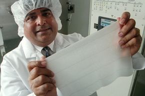 A man holds a piece of artificial skin from Integra. Grafts would be placed atop this piece.