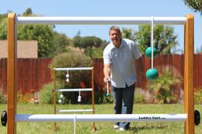 man playing ladder ball