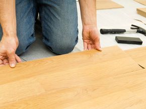 Laminate floors are installed over an underlayment using tongue-and-groove joints.