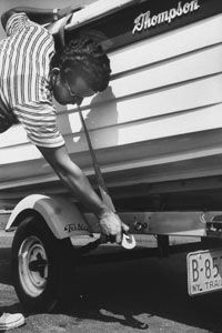 Removing trailer safety straps