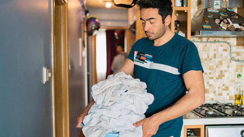 man doing laundry