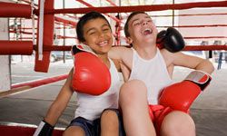 kids with boxing gloves laughing