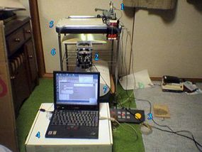 Takayuki Muranushi built an automatic book scanner.