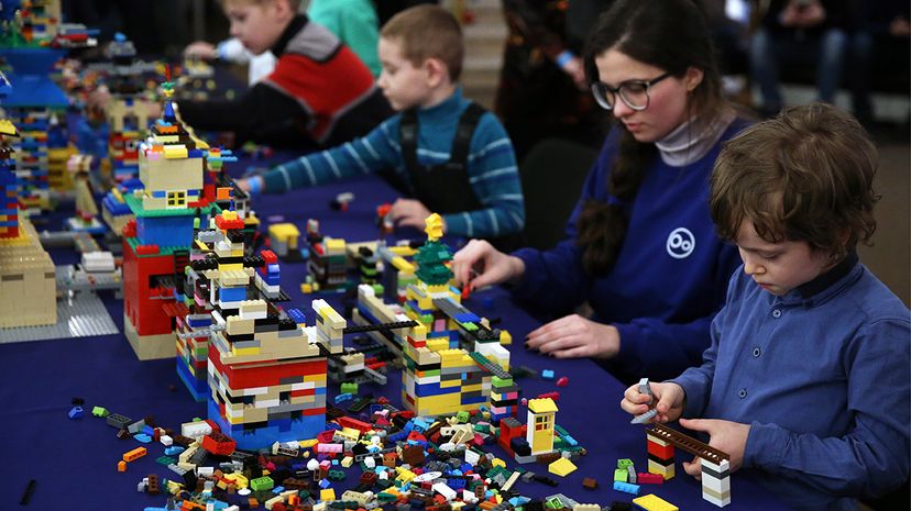 Boy playing with legos hot sale