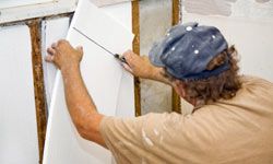 contractor installing Styrofoam insulation