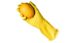 rubber glove holding lemon