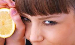 girl holding lemon slice