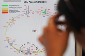 A scientist puzzles over a map of access conditions at the Large Hadron Collider just a few days before the massive underground laboratory first turned on in September 2008.