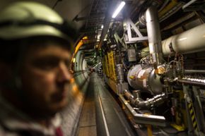 Sometimes the machine charged with facilitating head-spinning discoveries needs a little downtime. Here, a maintenance worker inspects the LHC tunnel on Nov. 19, 2013.