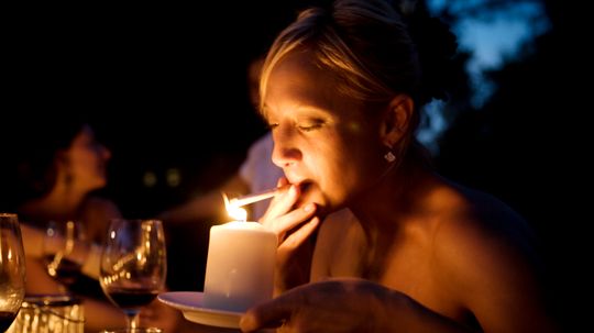 Does lighting a cigarette with a candle cause a sailor to die?