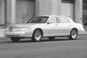 The 2001 Lincoln Town Car Cartier imitated the "stretch" that limos boasted, allowing for king-size rear leg room.”border=