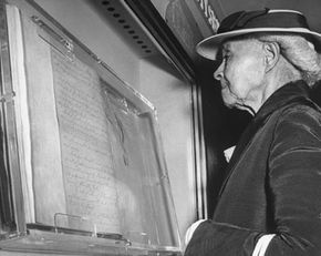 An ex-slave reads the Emancipation Proclamation in 1947.
