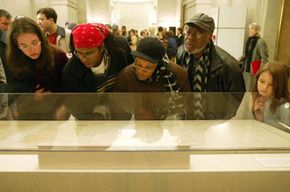 Visitors view the original Emancipation Proclamation during a one-day-only exhibit on Jan. 19, 2003, at the National Archives in Washington, D.C.