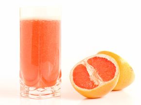 grapefruit with glass of juice