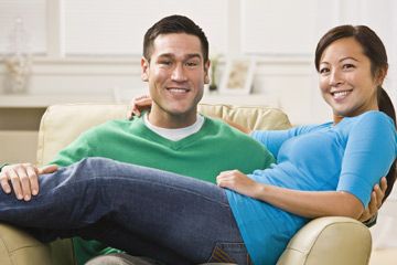 Couple sitting on couch