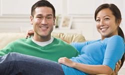 Couple sitting on couch