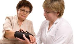 older woman with a broken bone sees a doctor