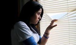 girl looking out window