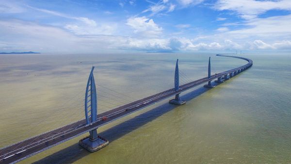 Man-made bridge spanning water, transporting people.