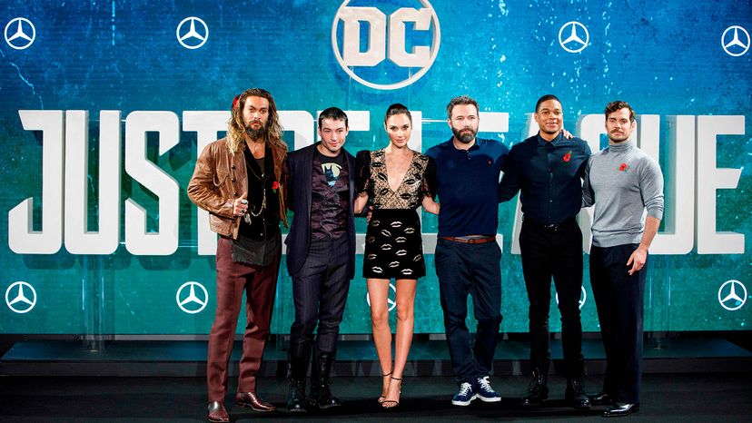 L-R: Jason Momoa, Ezra Miller, Gal Gadot, Ben Affleck, Ray Fisher and Henry Cavill pose at a photo call for the film &quot;Justice League&quot; in central London, Nov. 4, 2017.   TOLGA AKMEN/AFP via Getty Images