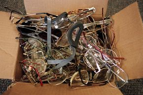 This cardboard box full of eyeglasses is just a small part of the many things found by employees around the Mind Eraser roller coaster at Elitch Gardens Theme and Water Park, Denver.