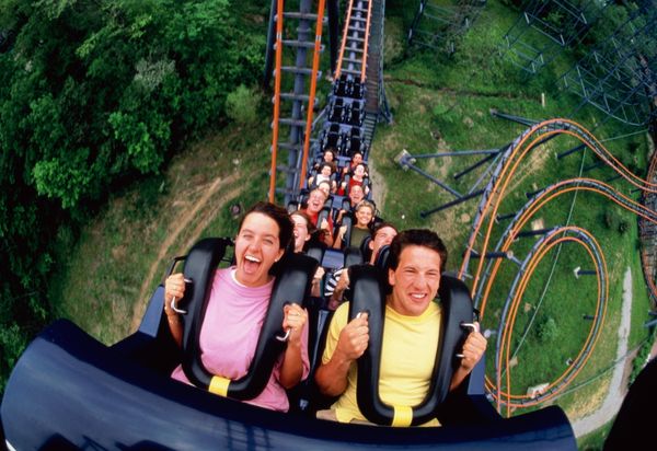 Men smiling outdoors in fun and happiness.