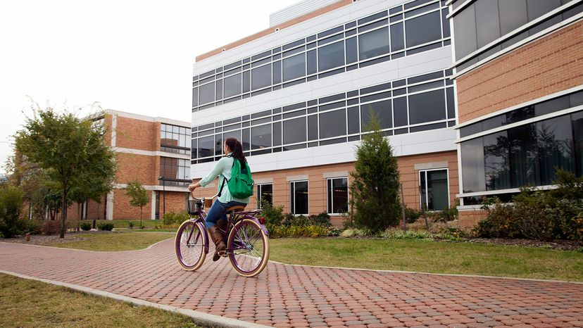 girl biking to class