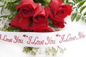 Bouquet of roses with "I love you" banner. 