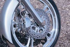 Dual front disc brakes are a welcome sight on a chopper with 124 cubic inches of power. Note the duplication of the wheel pattern in the disc hub.