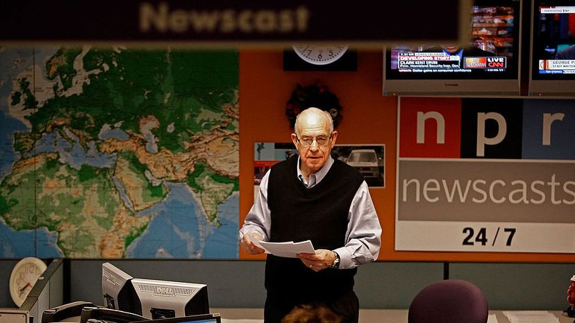 National Public Radio's Carl Kasell organizes news articles while preparing for one of his last newscasts at NPR, Dec. 30, 2009, in Washington, D.C. Chip Somodevilla/Getty Images