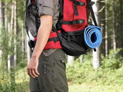 Exploring nature's forest with a hiking backpack.