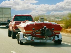 A speed boat heading for the lake.