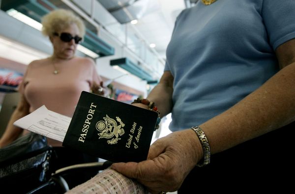 man holds passport