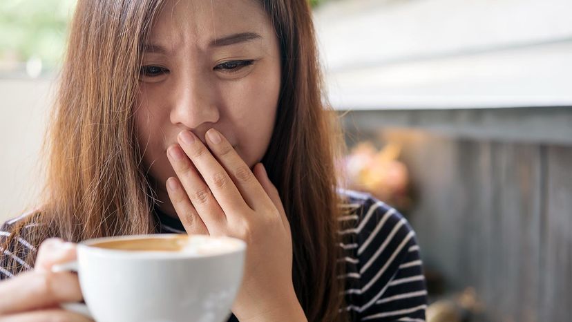 woman smelling coffee