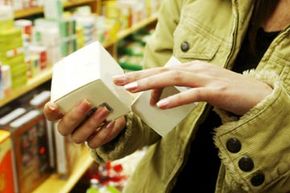 woman looking at product label