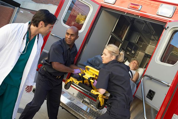 Men working to rescue in ambulance paramedic.