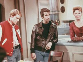 Actors Ron Howard, as Richie Cunningham, Henry Winkler, as Arthur "Fonzie" Fonzarelli, and Marion Ross, as Marion Cunningham, in a scene from "Happy Days," circa 1975.”width=