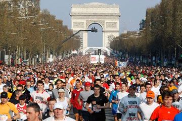 Crowd of people cheering in a capital city.